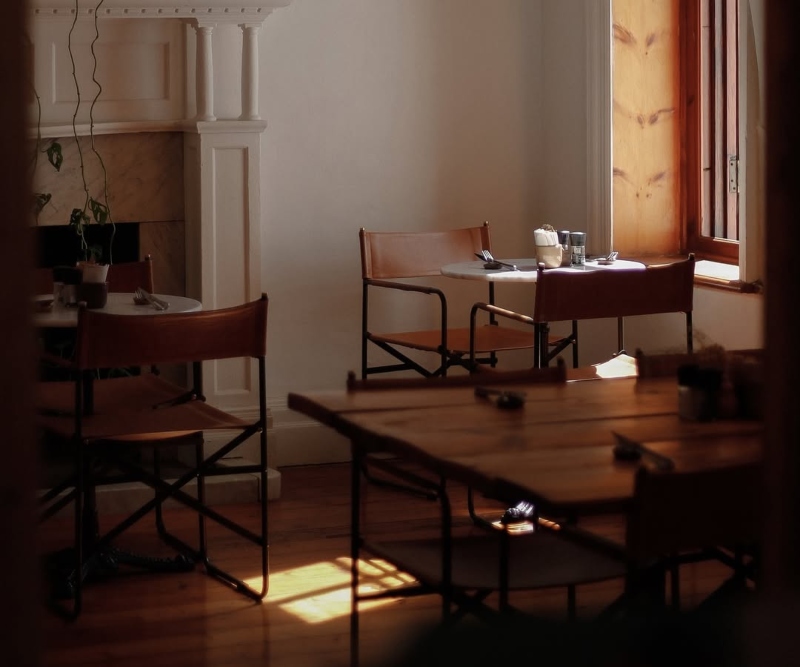Corner chair and table at The Strangers Club