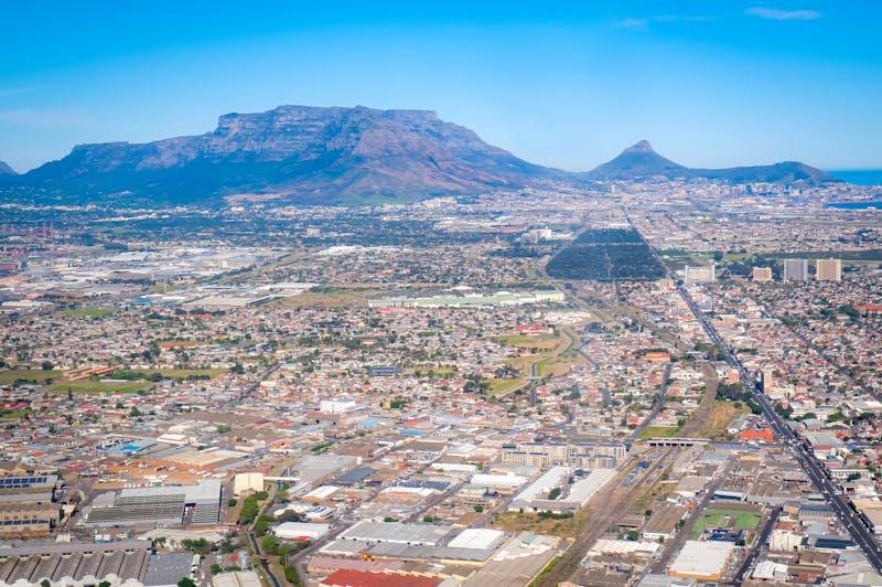 An expansive view of houses with mountain backdrops in the southern suburbs of Cape Town
