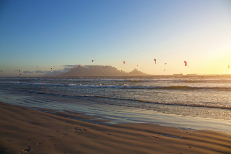 Kite surfers with Table Mountain in the background in Bloubergstrand Cape Town